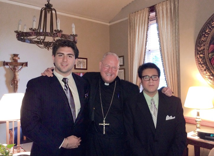 Cardinal Dolan (center) with Michael Menconi FCRH '14 (left) and Ken Ochs FCRH '14 (right)